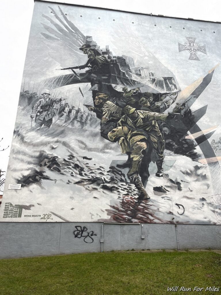 a mural of soldiers on a wall