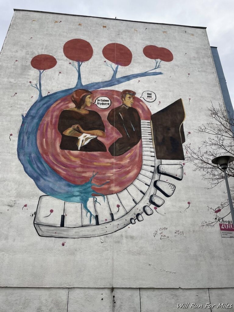 a mural of a man and woman playing piano