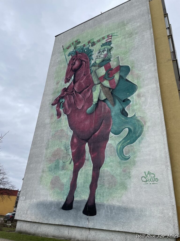a mural of a horse and a man on a horse