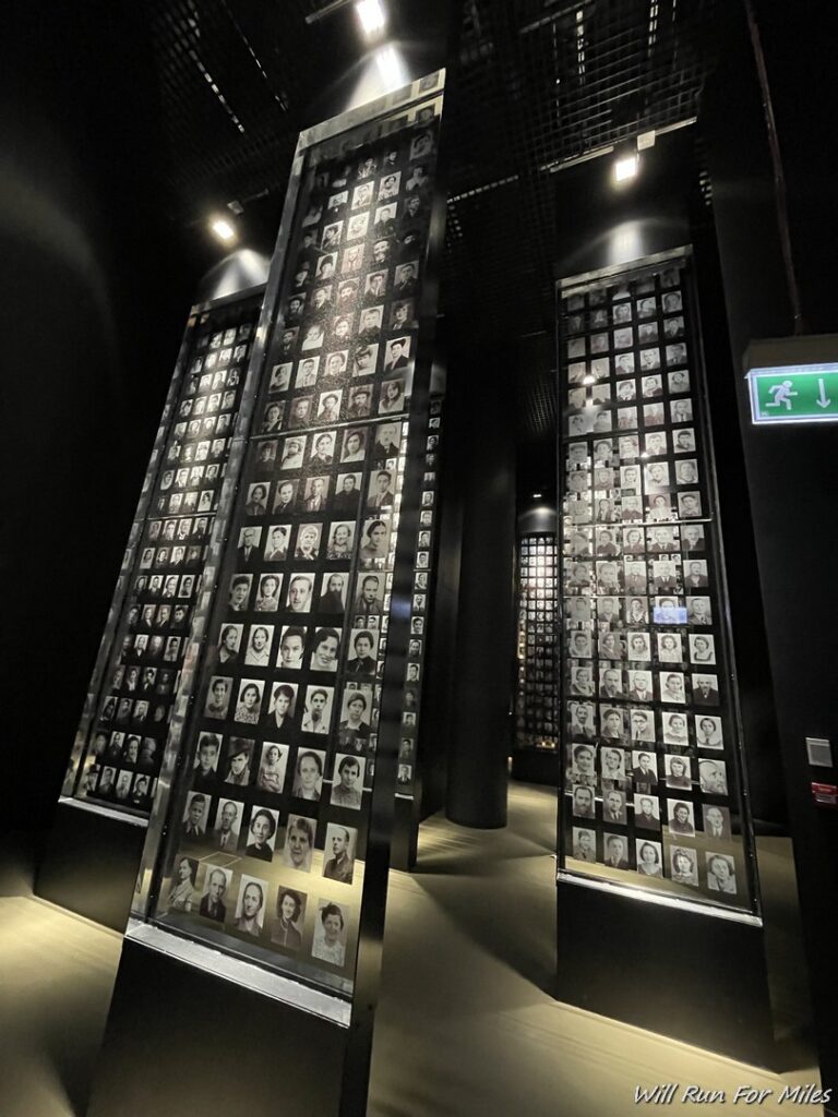 a display of photos on a wall