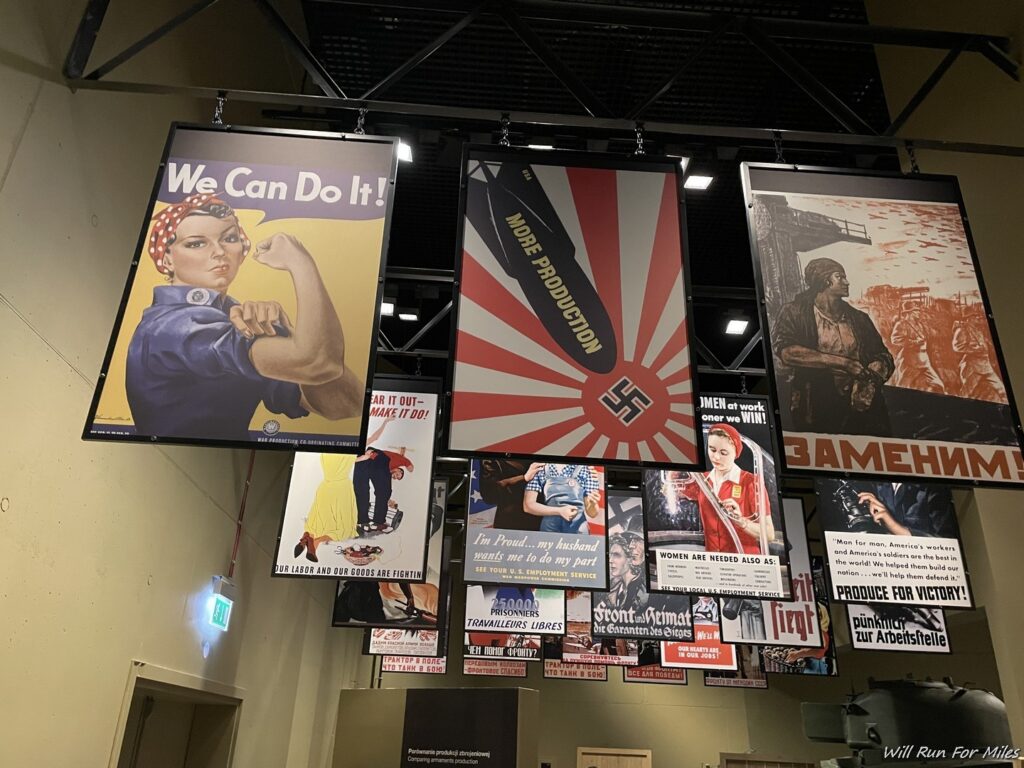 a group of posters from a ceiling