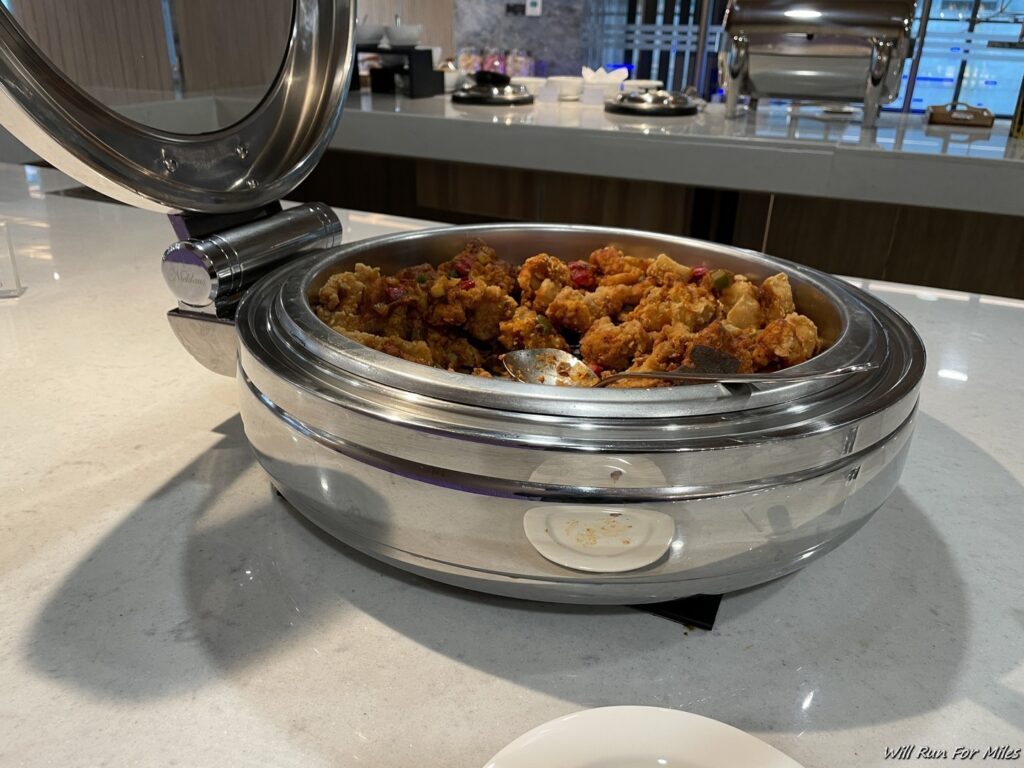 a large silver container with food in it