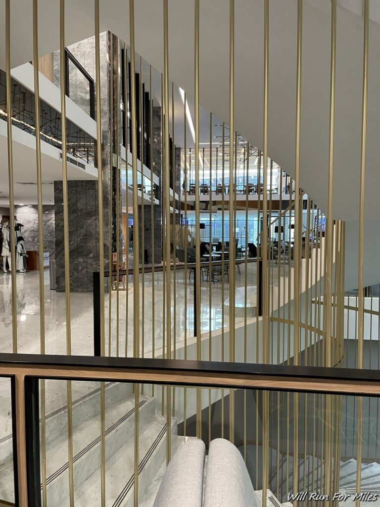 a staircase with gold bars