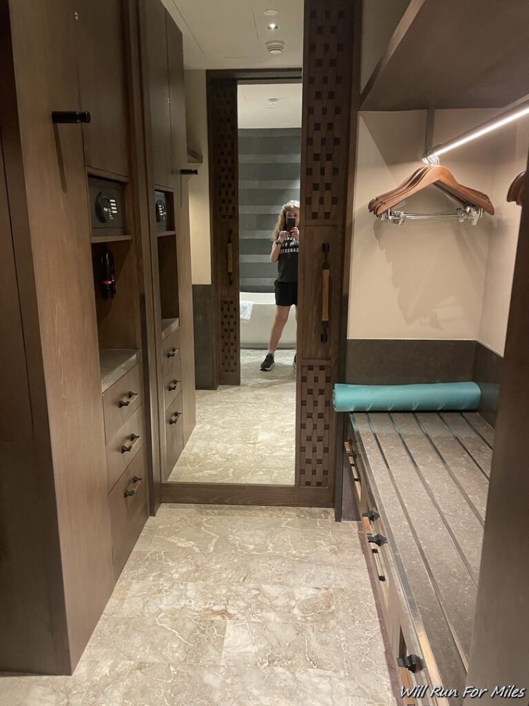 a woman taking a selfie in a hallway