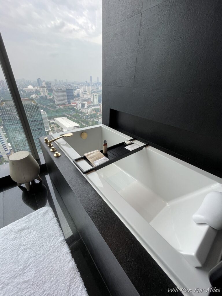 a bathtub with a view of a city