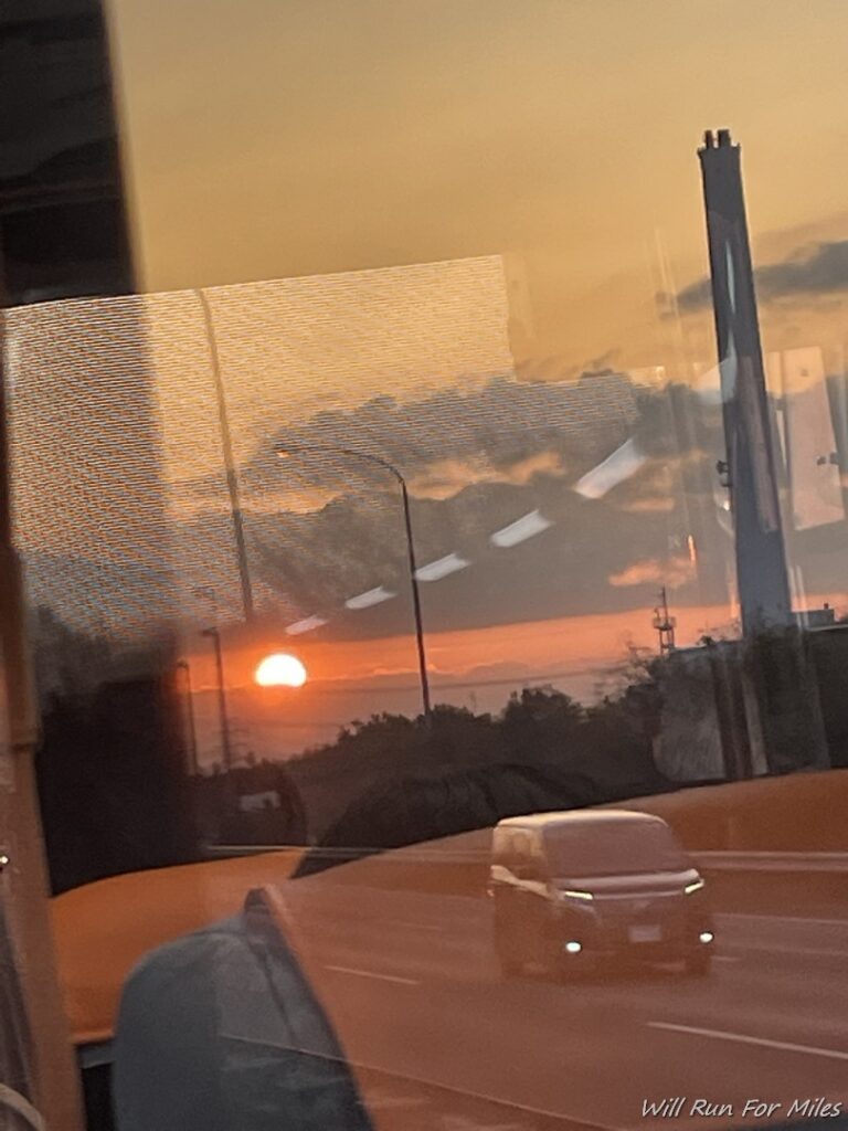 a reflection of a sunset in a window