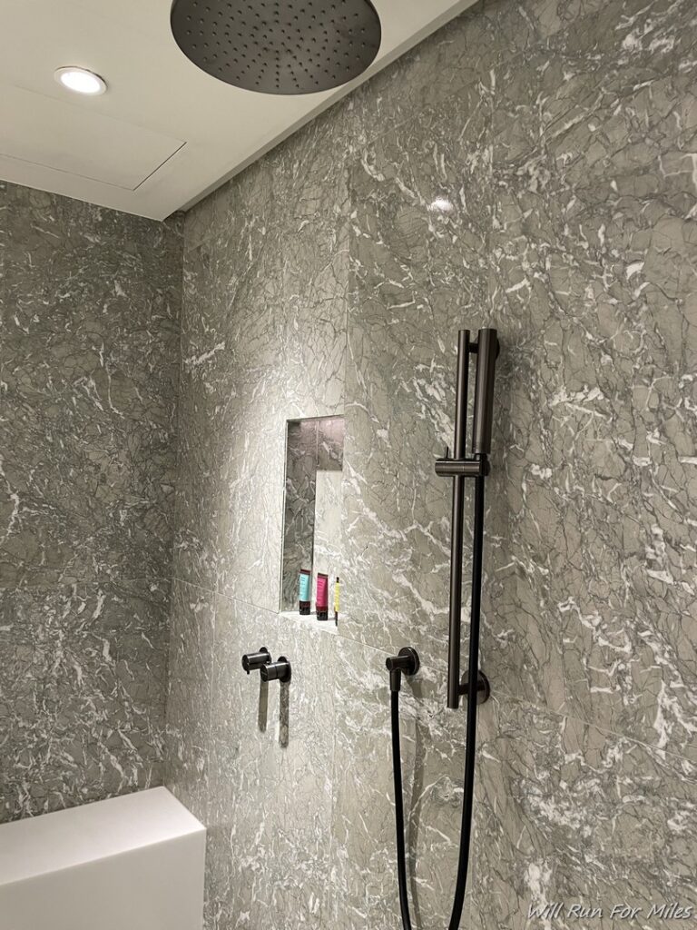 a shower with a shower head and shower head