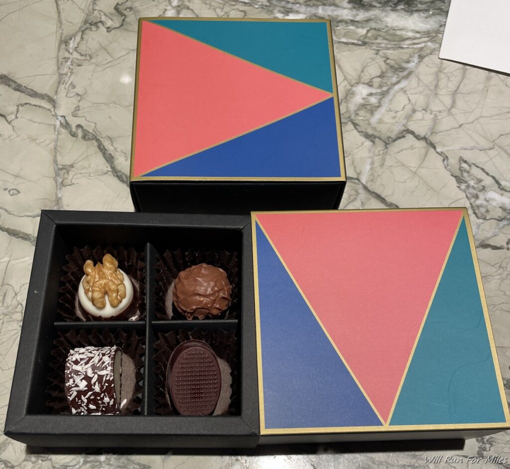a box of chocolates on a marble surface