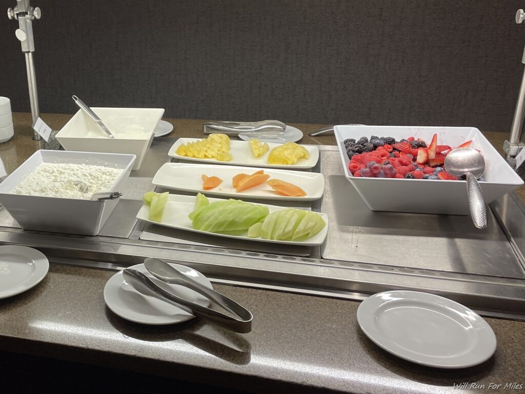 a buffet with different types of fruit and vegetables