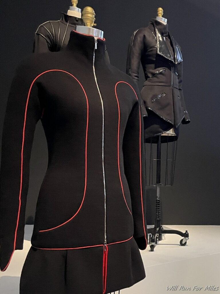 a mannequins wearing black and red jackets