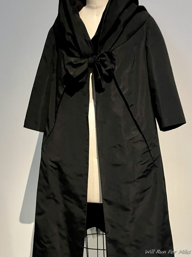 a black coat on a mannequin