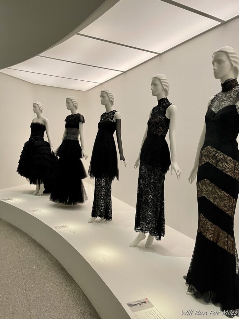 a group of mannequins in dresses