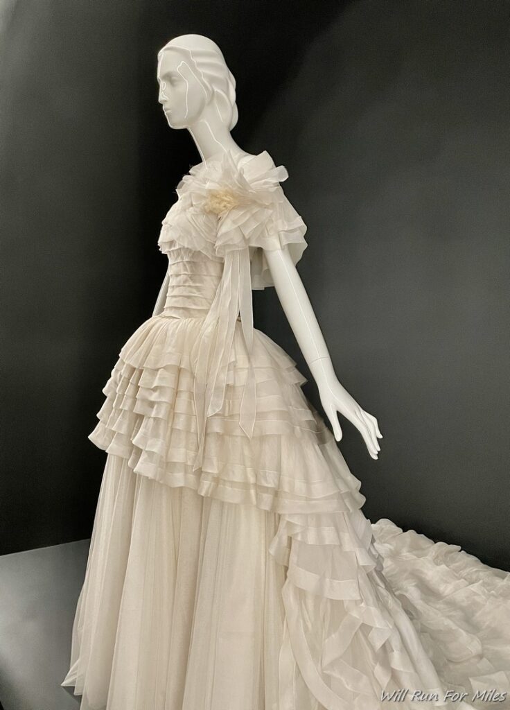 a mannequin wearing a white dress