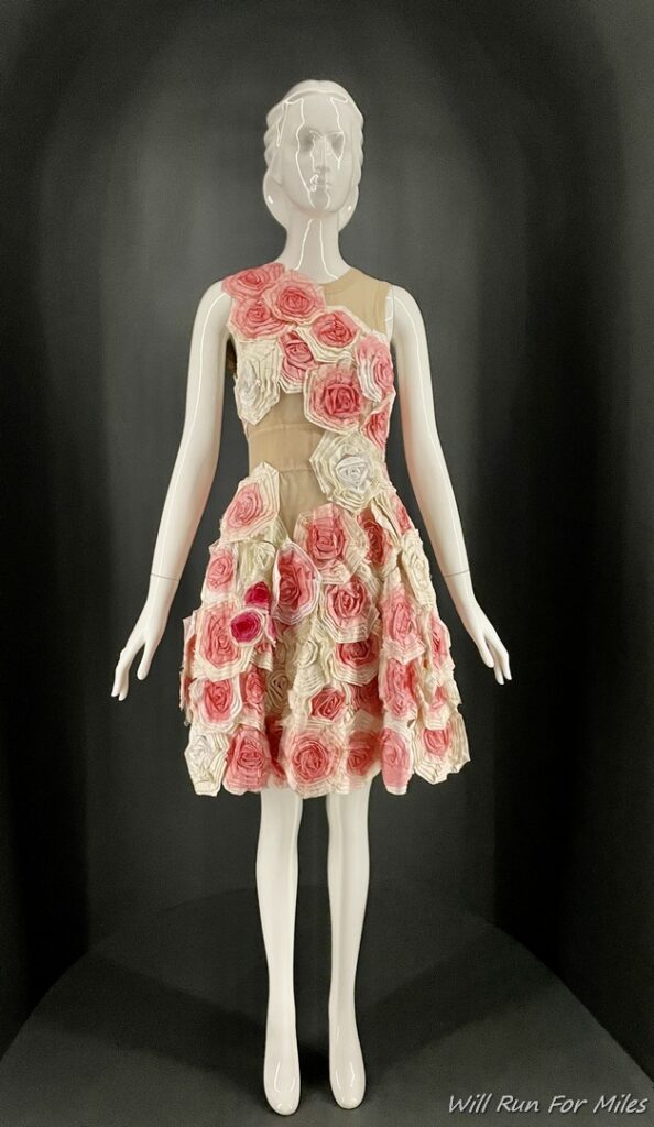 a mannequin wearing a dress with flowers