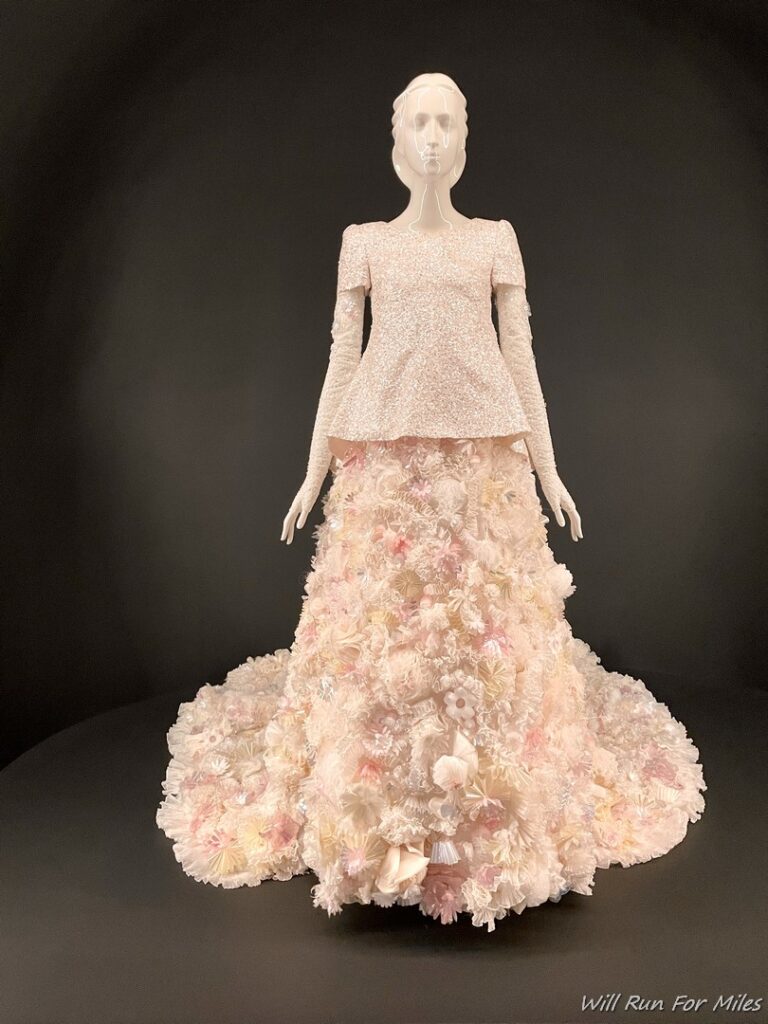 a mannequin wearing a dress made of flowers