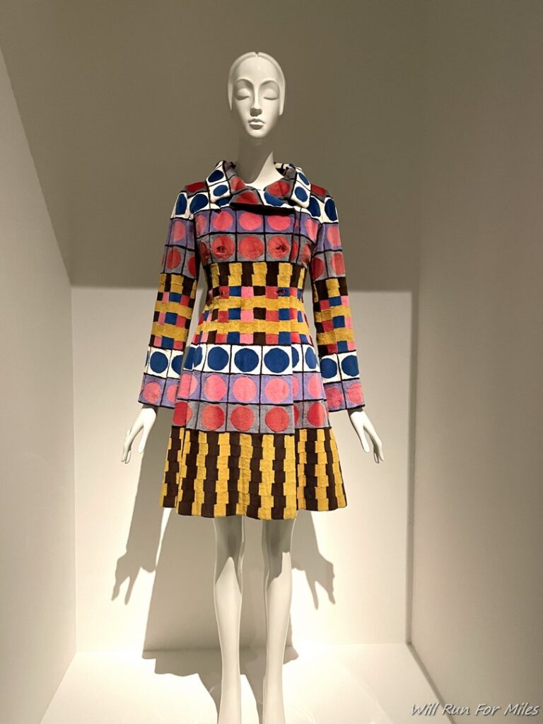 a mannequin wearing a colorful dress