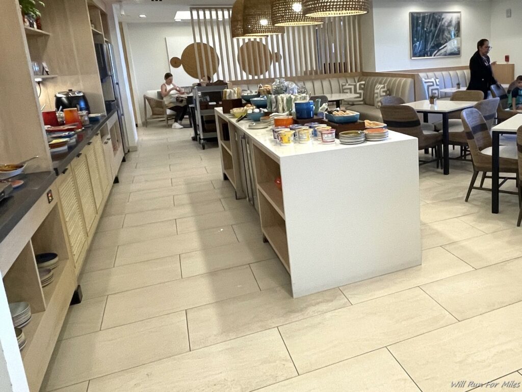 a kitchen with a table and chairs