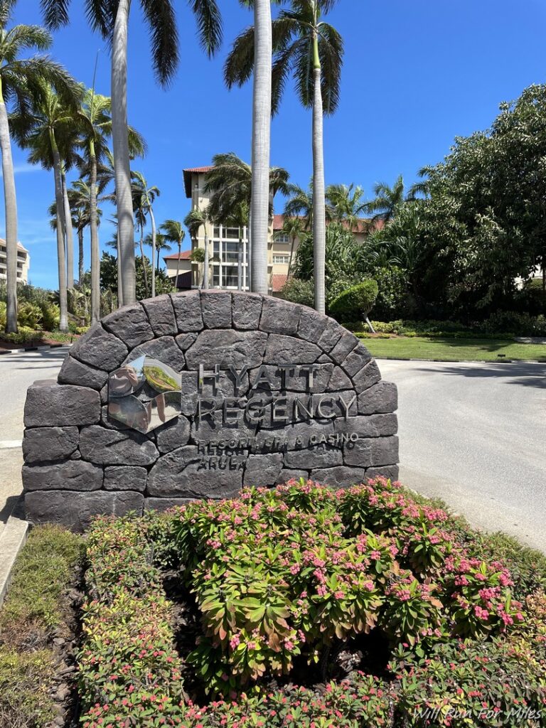 a sign in front of a hotel