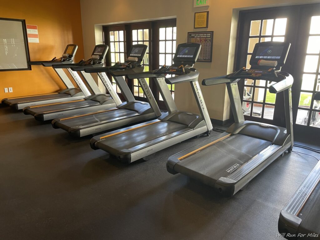 a group of treadmills in a room
