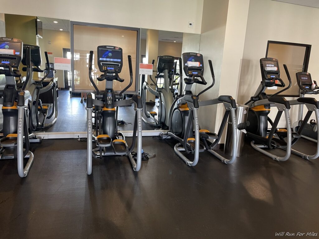 a group of exercise machines in a room