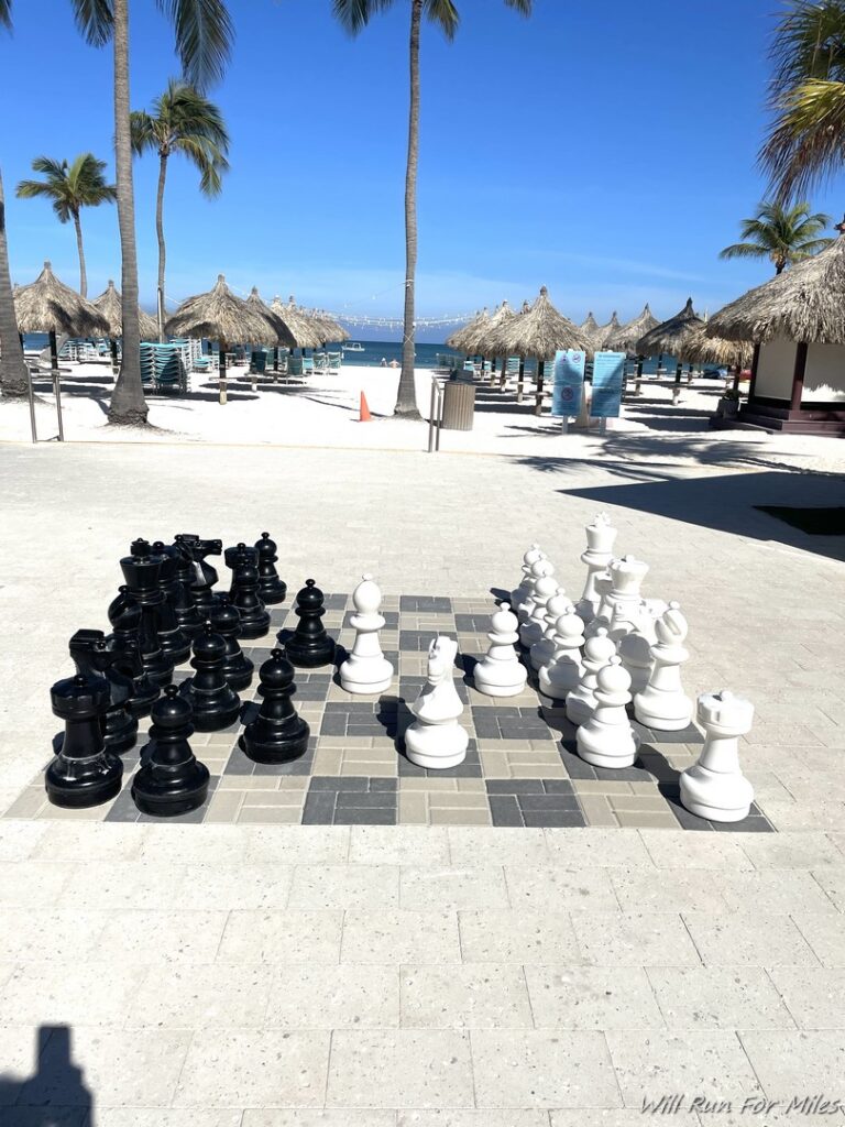 a chess board on a beach