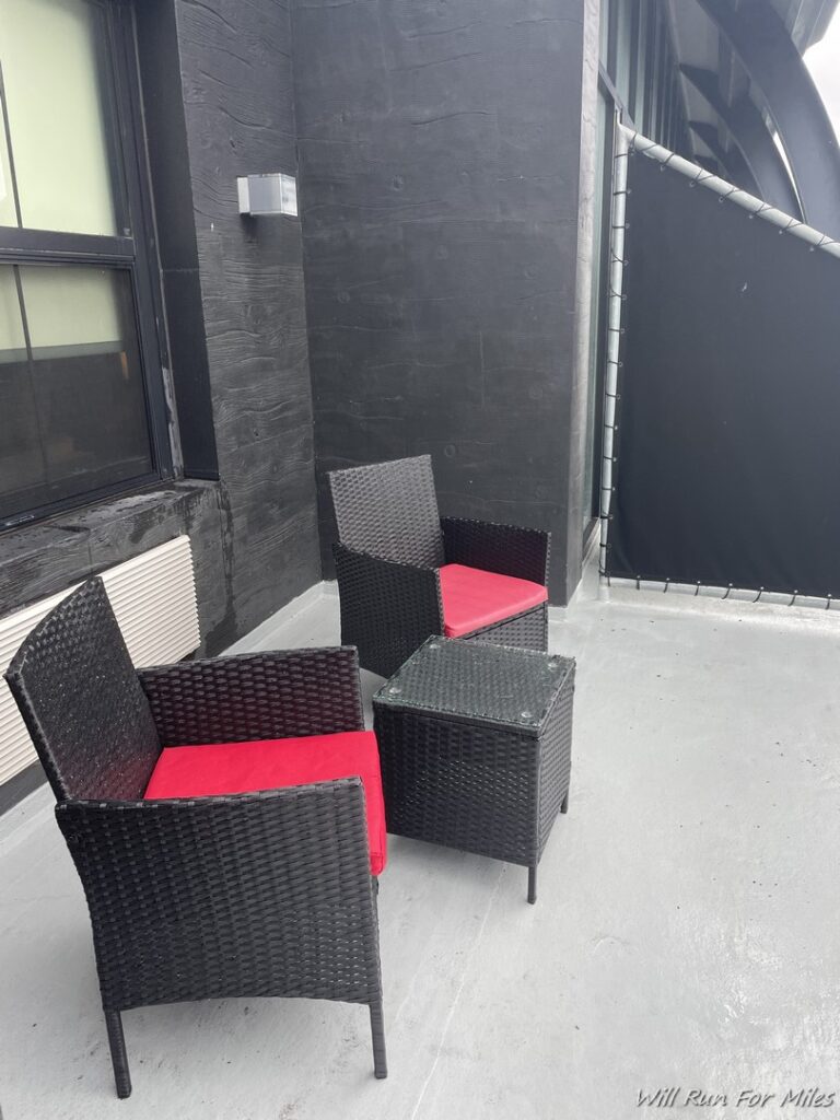 a group of chairs and a table on a patio