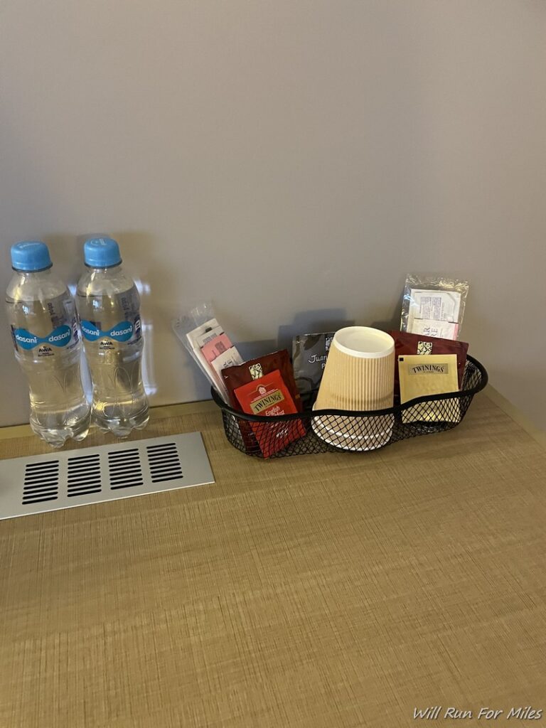 a table with a basket of food and water bottles