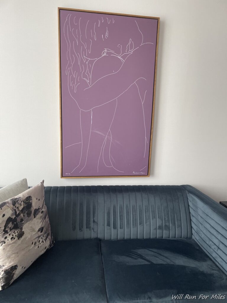 a purple framed picture on a wall