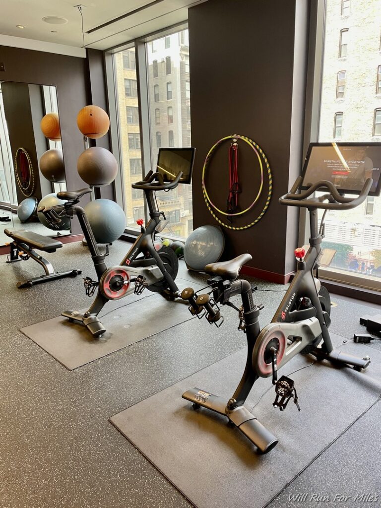 a room with exercise bikes and exercise balls