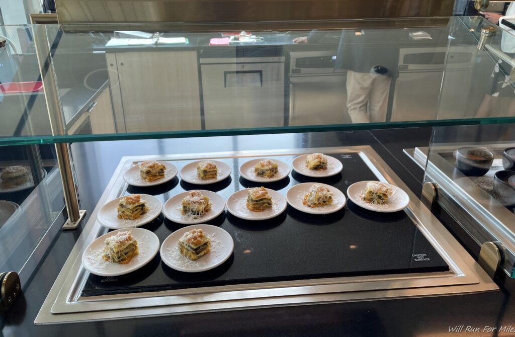 a group of small plates of food on a counter