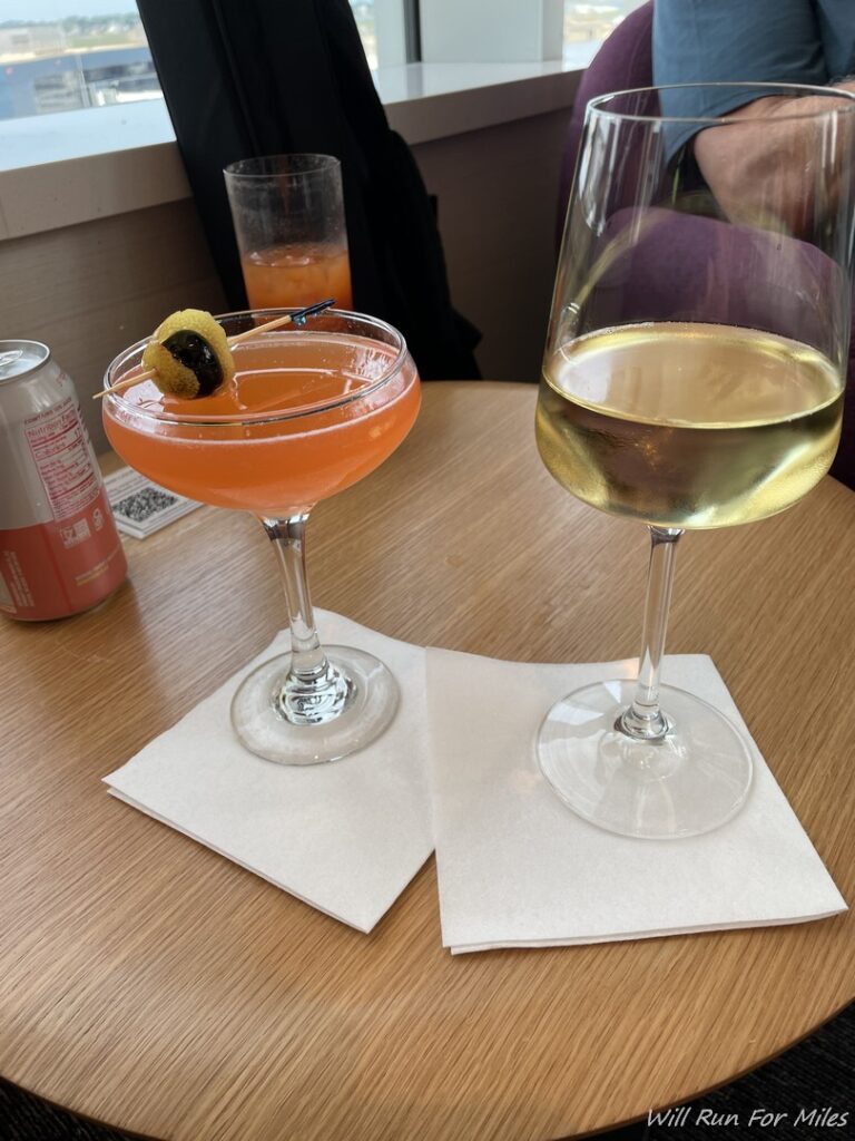 two glasses of drinks on a table