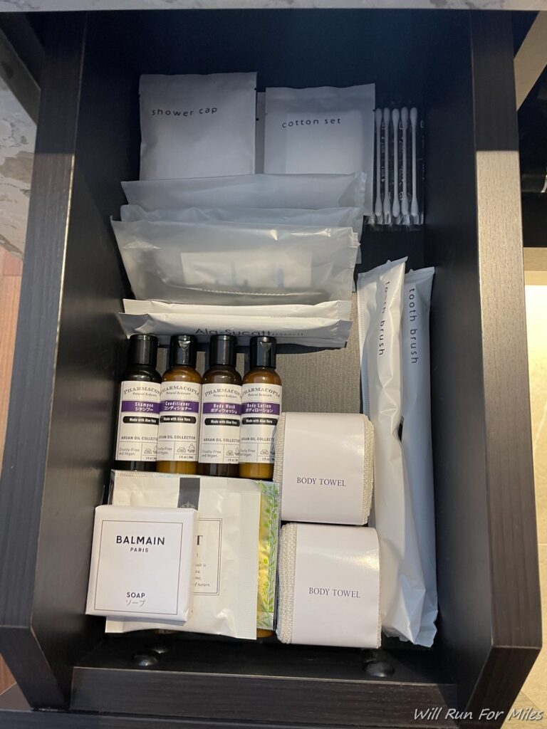 a drawer full of toiletries and other items