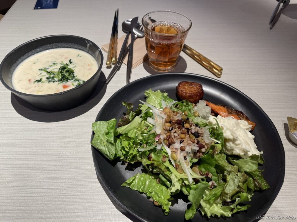 a plate of salad and soup