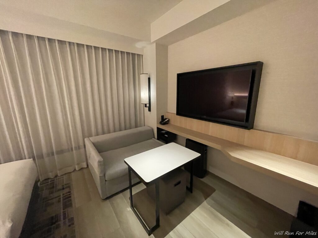 a room with a tv and a couch