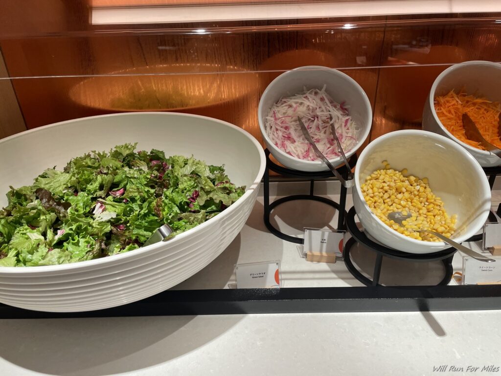 a salad in bowls on a shelf