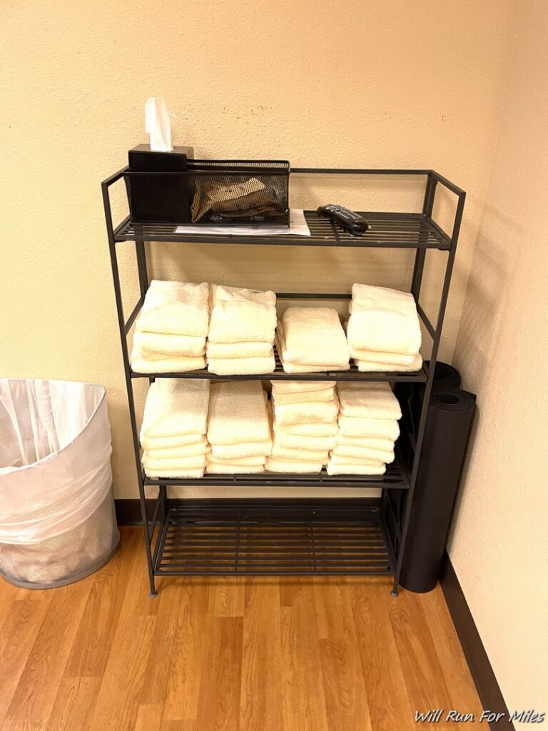 a shelf with towels on it