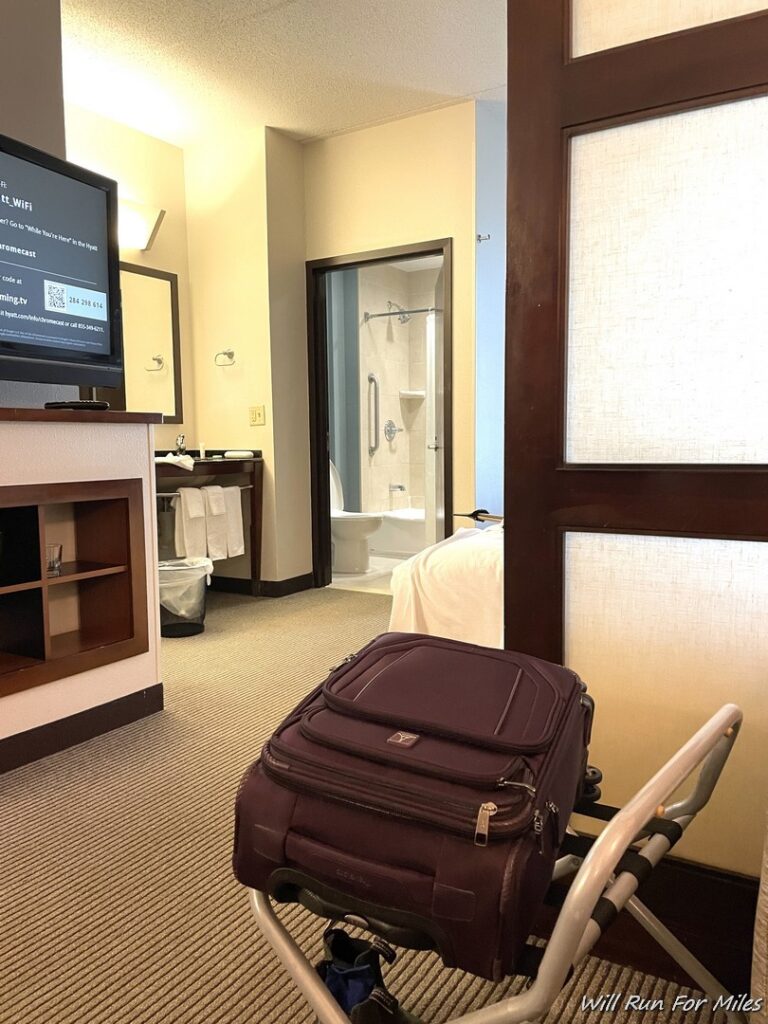 a luggage on a cart in a hotel room