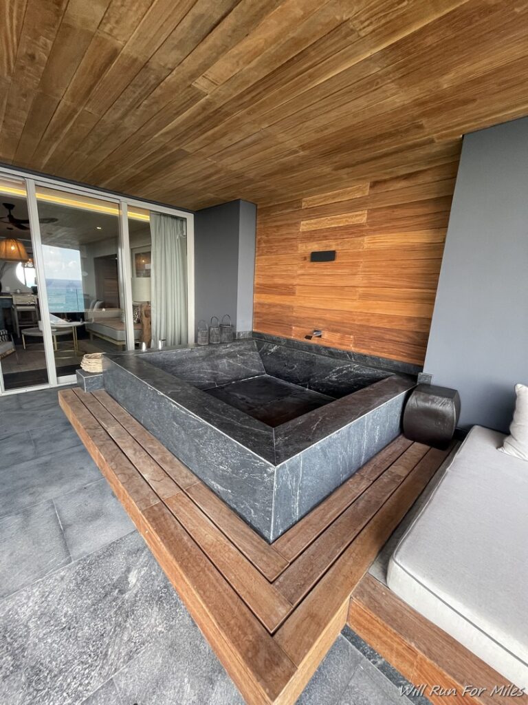a stone bathtub in a room