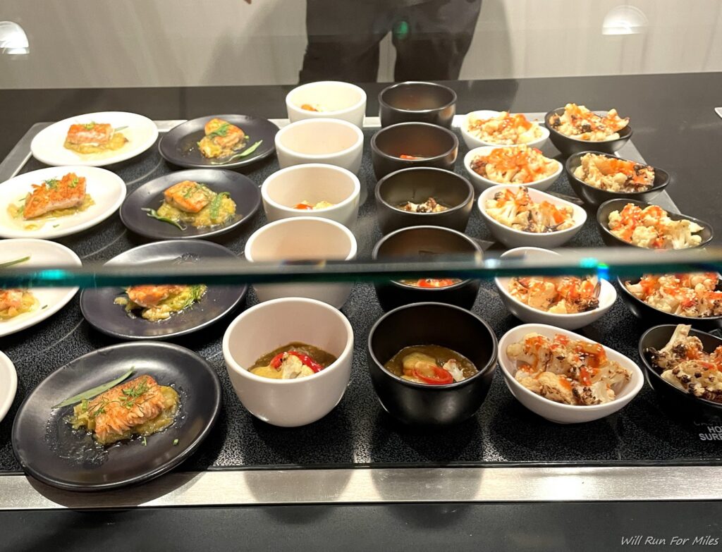 a display case with plates of food