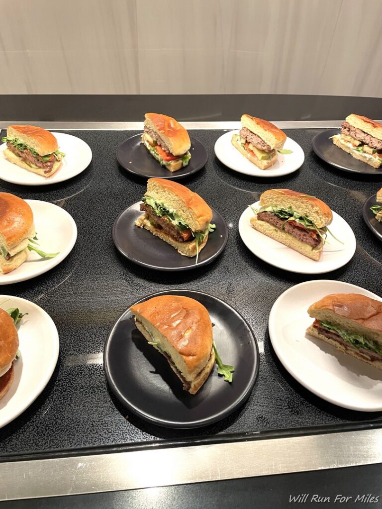 a group of plates of sandwiches