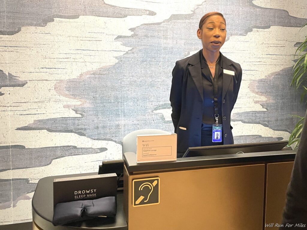 a woman standing behind a desk