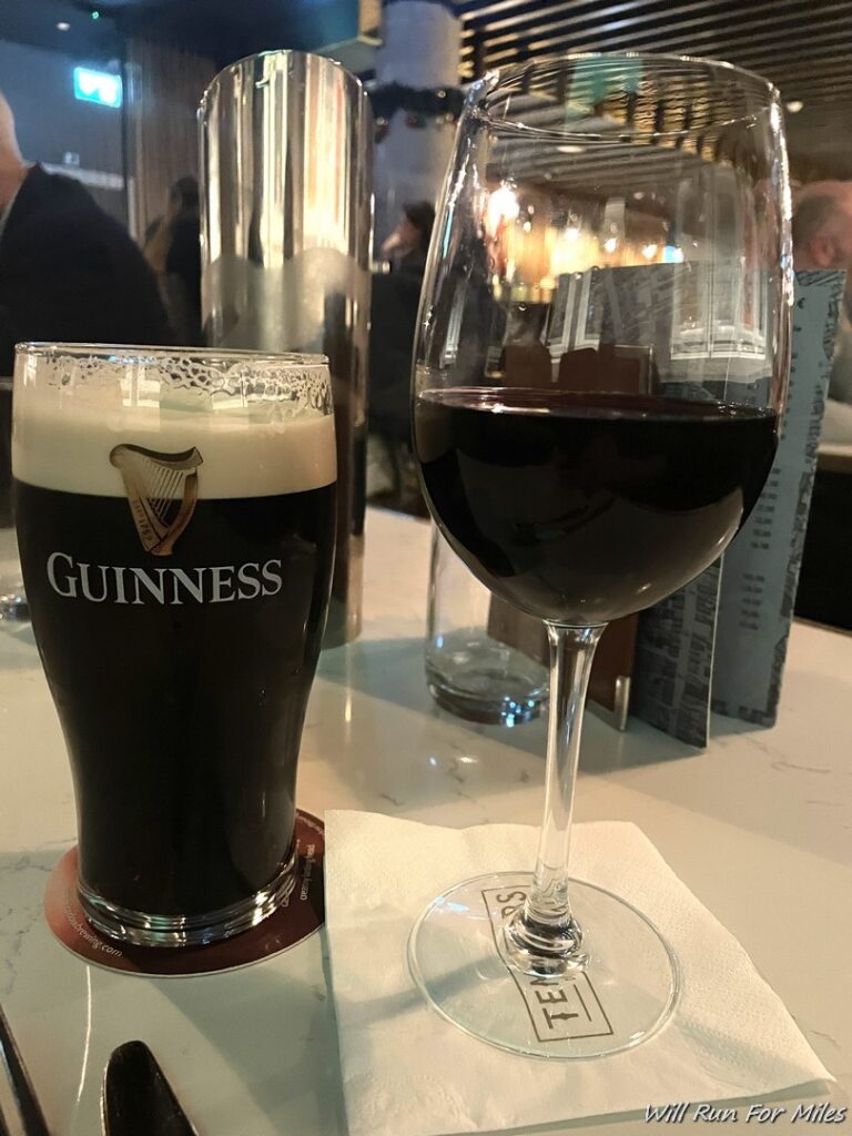 a glass of beer next to a glass of beer