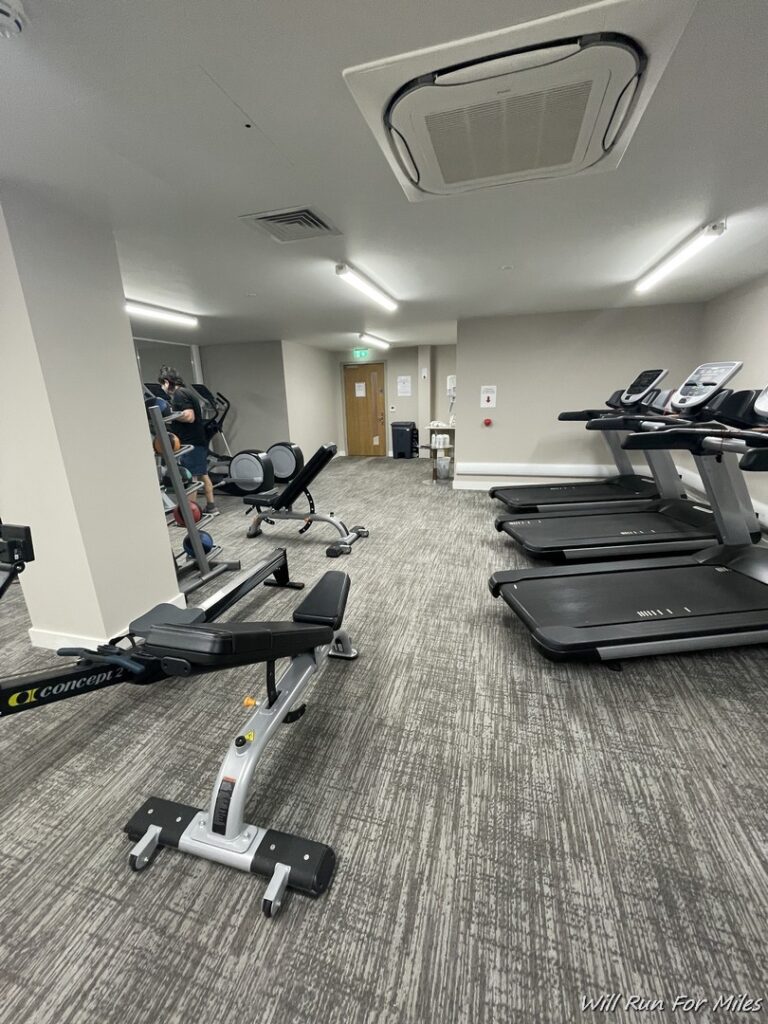 a room with treadmills and exercise equipment