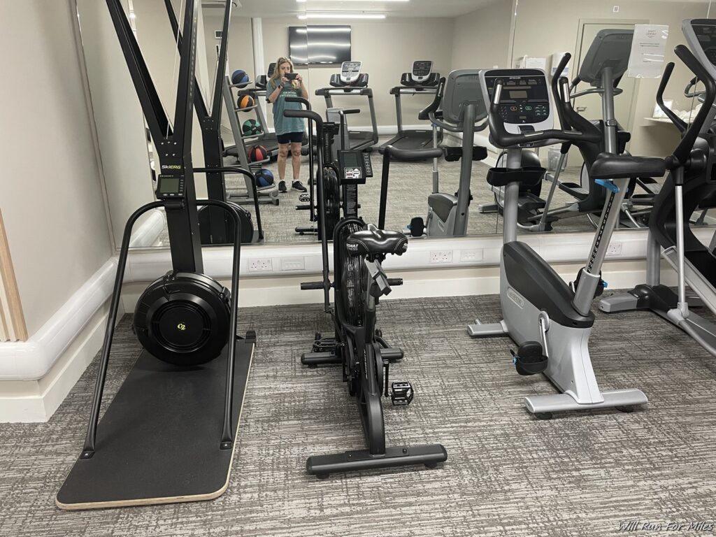 a mirror with exercise equipment in a room