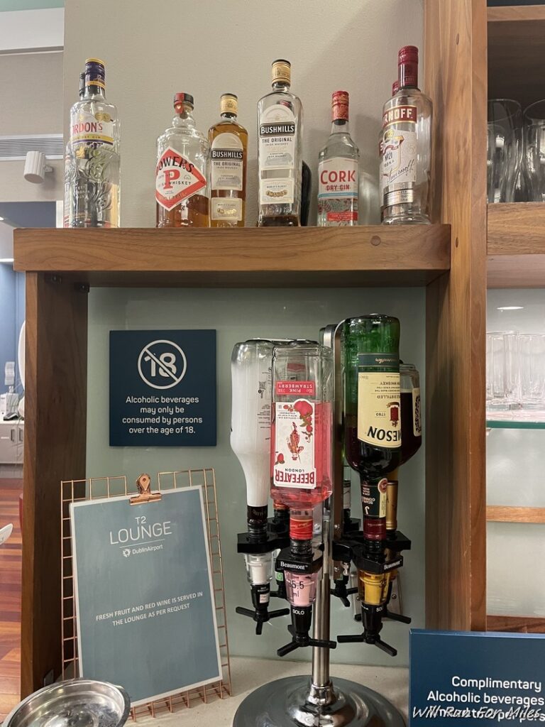 a shelf with bottles of alcohol on it
