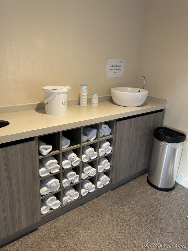 a bathroom with towels on shelves