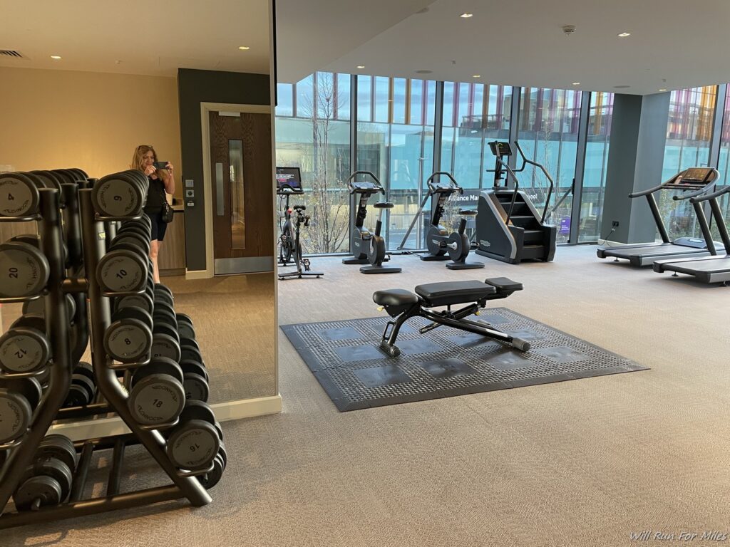 a room with a mirror and exercise equipment