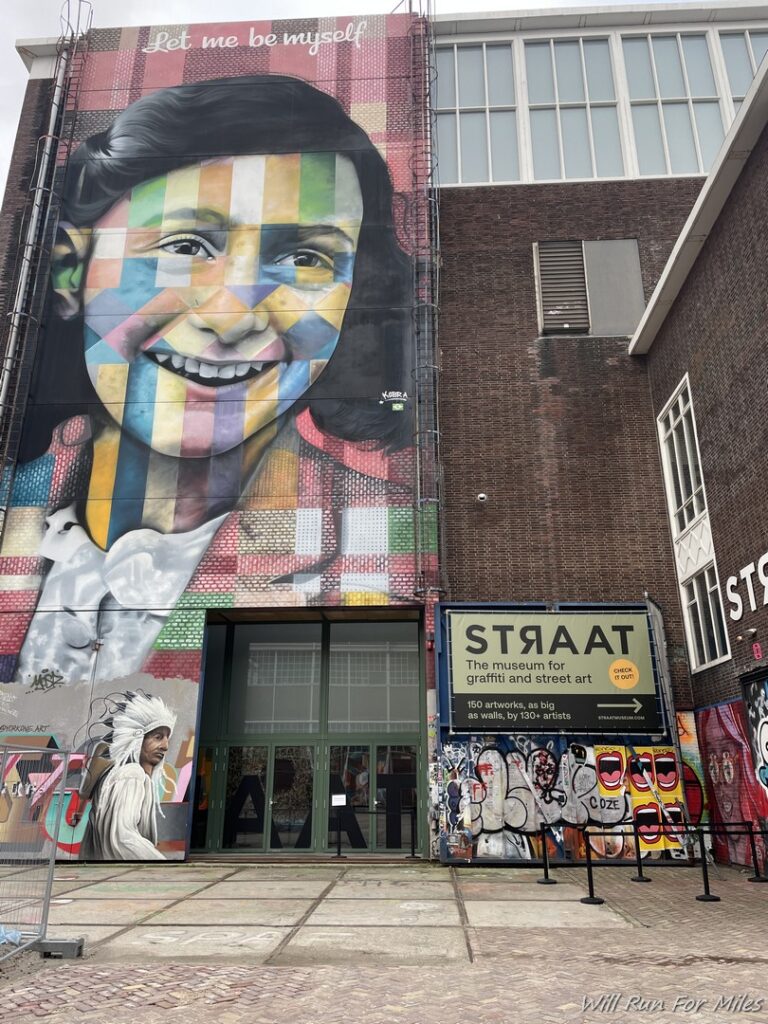 a mural of a woman on a brick building