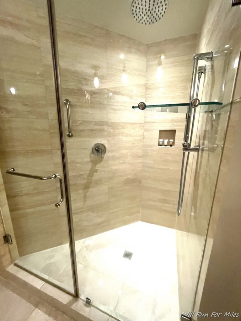 a glass shower with a glass door