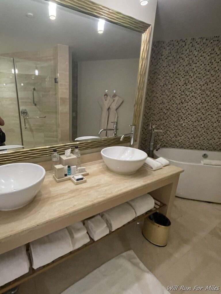 a bathroom with a large mirror and sinks